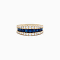 The Royale Bleu 14K Yellow Gold Blue Sapphire and Diamond Ring showcases a central row of square-cut blue sapphires bordered by two rows of round white diamonds on a wide band.