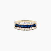 The Royale Bleu 14K Yellow Gold Blue Sapphire and Diamond Ring showcases a central row of square-cut blue sapphires bordered by two rows of round white diamonds on a wide band.