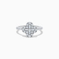 The Classique 14K White Gold Diamond Ring showcases a clover-shaped cluster of round and baguette diamonds on a slim, diamond-studded band, set against a white background.