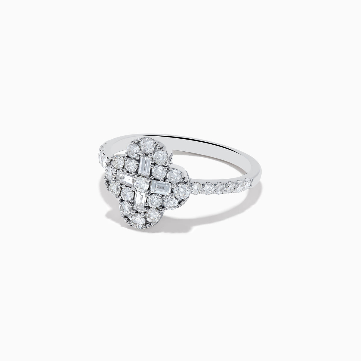 The Classique 14K White Gold Diamond Ring showcases a clover-shaped cluster of round and baguette diamonds on a slim, diamond-studded band, set against a white background.