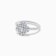 The Classique 14K White Gold Diamond Ring showcases a clover-shaped cluster of round and baguette diamonds on a slim, diamond-studded band, set against a white background.