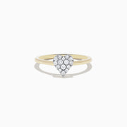 The 14K Yellow Gold Pave Diamond Heart Ring showcases a heart-shaped cluster of sparkling white diamonds on a slim gold band, displayed on a white background.