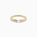 The D'Oro 14K Yellow Gold Diamond Ring showcases a single round-cut diamond solitaire in a minimalist prong setting, presented on a white background.