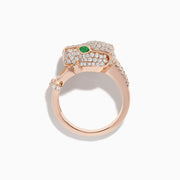 The Signature 14K Rose Gold Emerald and Diamond Panther Ring features a panther’s head with diamond accents, emerald-green gemstone eyes, and two curved diamond-studded bands held in its mouth.