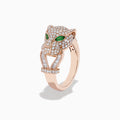 The Signature 14K Rose Gold Emerald and Diamond Panther Ring features a panther’s head with diamond accents, emerald-green gemstone eyes, and two curved diamond-studded bands held in its mouth.