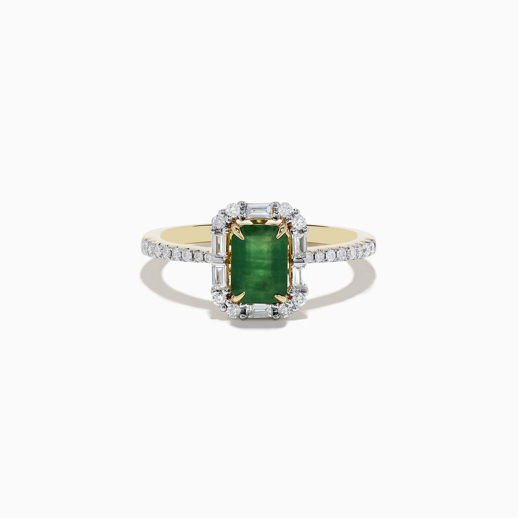 The 14K Yellow Gold Emerald and Diamond Ring features an emerald-cut green gemstone at the center, surrounded by round diamonds and enhanced with additional diamonds on the band.