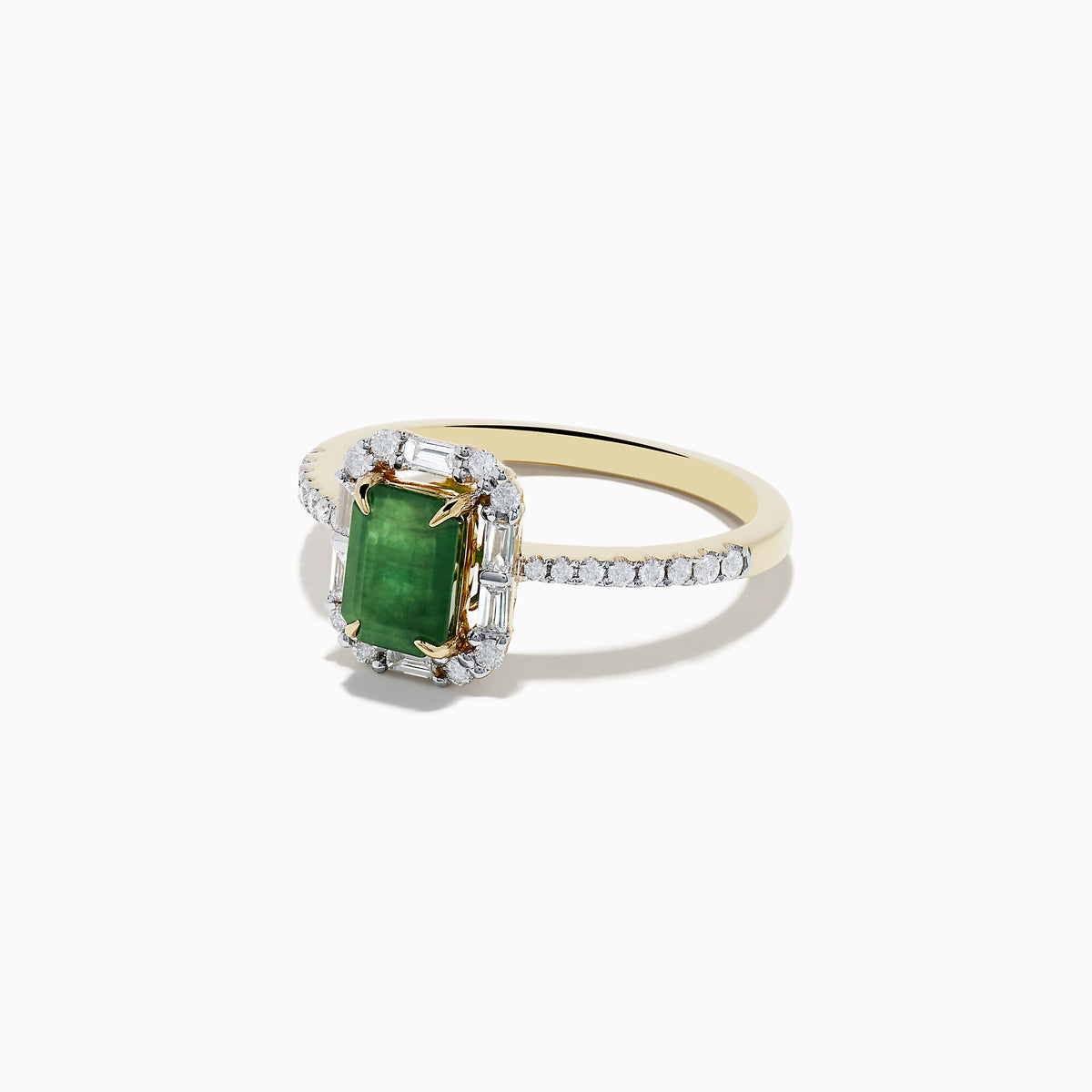 The 14K Yellow Gold Emerald and Diamond Ring features an emerald-cut green gemstone at the center, surrounded by round diamonds and enhanced with additional diamonds on the band.