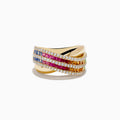 The Watercolors 14K Gold Multi Sapphire and Diamond Crossover ring showcases crisscrossed bands with blue, pink, and orange sapphires bordered by sparkling diamonds, elegantly displayed on a white background.