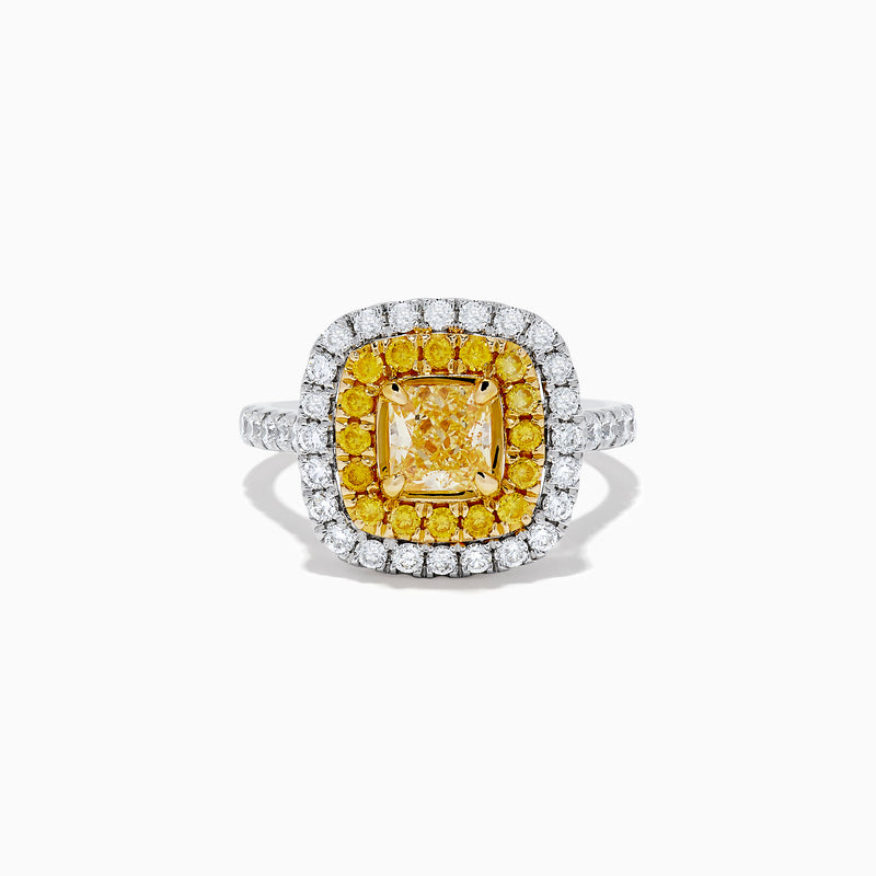The Canare 14k Two Tone Gold Cushion Cut Double Halo Yellow Diamond Ring (1.86 TCW) features a vibrant yellow diamond centerpiece, framed by a double halo of yellow and white diamonds on a sleek two-tone band.