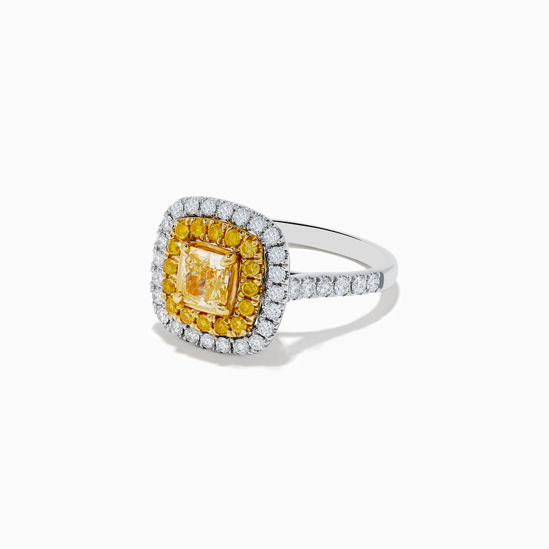 The Canare 14k Two Tone Gold Cushion Cut Double Halo Yellow Diamond Ring (1.86 TCW) features a vibrant yellow diamond centerpiece, framed by a double halo of yellow and white diamonds on a sleek two-tone band.