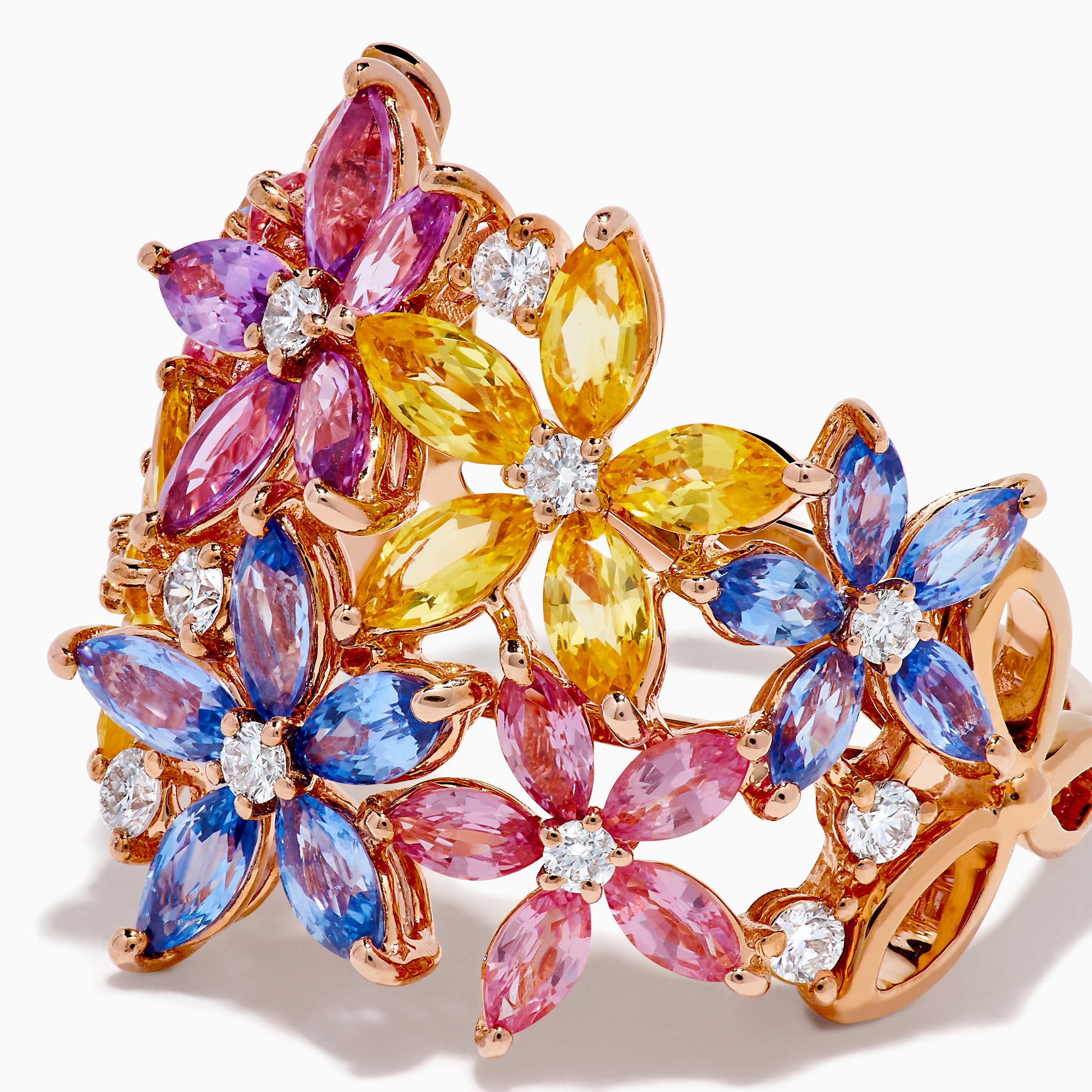 The Watercolors 14K Rose Gold Multi Sapphire and Diamond Flowers Ring showcases floral designs with blue, pink, yellow, and purple sapphires as petals, accented by small diamonds, set against a white background.