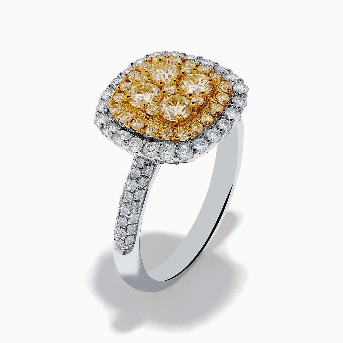 The Canare 14K Two Tone Gold White and Yellow Diamond Ring features a square cluster of four yellow diamonds, surrounded by a halo and band of sparkling white diamonds.