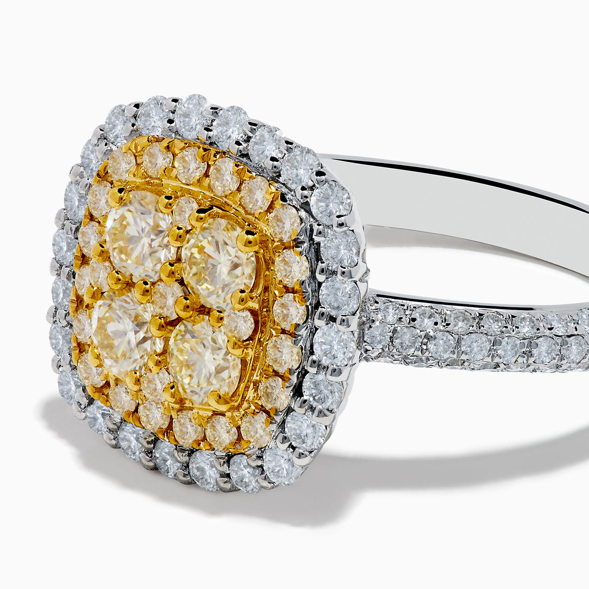 The Canare 14K Two Tone Gold White and Yellow Diamond Ring features a square cluster of four yellow diamonds, surrounded by a halo and band of sparkling white diamonds.