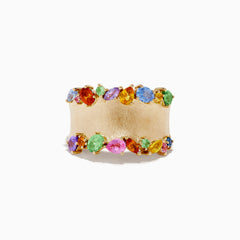 The Watercolors 14K Yellow Gold Multi Sapphire Ring features a wide matte gold band adorned with colorful oval and round sapphires set along the top and bottom edges.