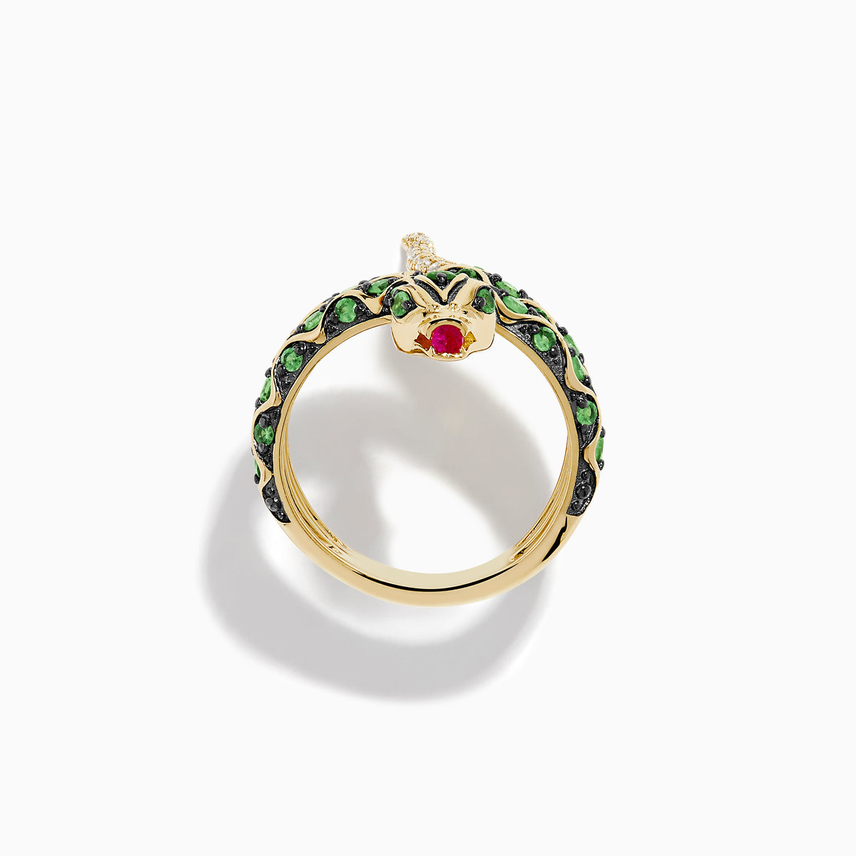 The 14K Yellow Gold Tsavorite and Diamond Snake Ring features a coiled snake design with tsavorites along its body, a red gemstone on its head, and diamonds accenting the tail.