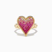 The Novelty 14K Yellow Gold Pink Sapphire and Diamond Heart Ring features a large heart-shaped design with pink sapphires and diamonds in a gradient pattern, set against a white background.