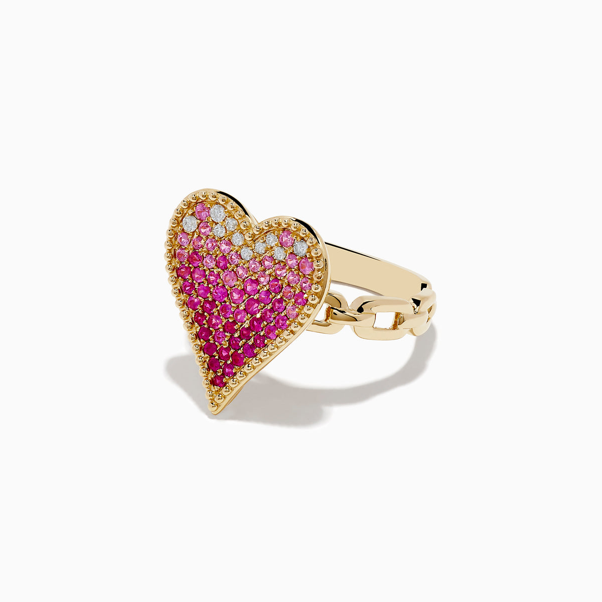 The Novelty 14K Yellow Gold Pink Sapphire and Diamond Heart Ring features a large heart-shaped design with pink sapphires and diamonds in a gradient pattern, set against a white background.