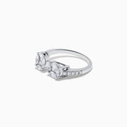 The Pave Classica 14K White Gold Open Shank Diamond Ring features oval and round-cut white diamonds in clustered settings, with a band accented by shimmering side diamonds for added elegance.