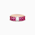 The 14k Rose Gold Pink and White Sapphire Ring features a central rectangular white sapphire, flanked by rectangular pink sapphires on each side, all set in rose gold and displayed against a white background.