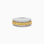The Canare 18k Two Tone Gold Cushion Cut Yellow Diamond Band (1.70 TCW) features a central row of cushion cut yellow diamonds, bordered by two rows of small clear diamonds, set against polished gold.