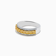 The Canare 18k Two Tone Gold Cushion Cut Yellow Diamond Band (1.70 TCW) features a central row of cushion cut yellow diamonds, bordered by two rows of small clear diamonds, set against polished gold.