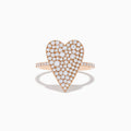 The Pave Rose 14K Rose Gold Diamond Heart Ring features a large diamond-encrusted heart centerpiece with additional diamonds along the band, shown on a white background.