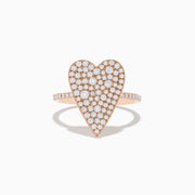 The Pave Rose 14K Rose Gold Diamond Heart Ring features a large diamond-encrusted heart centerpiece with additional diamonds along the band, shown on a white background.