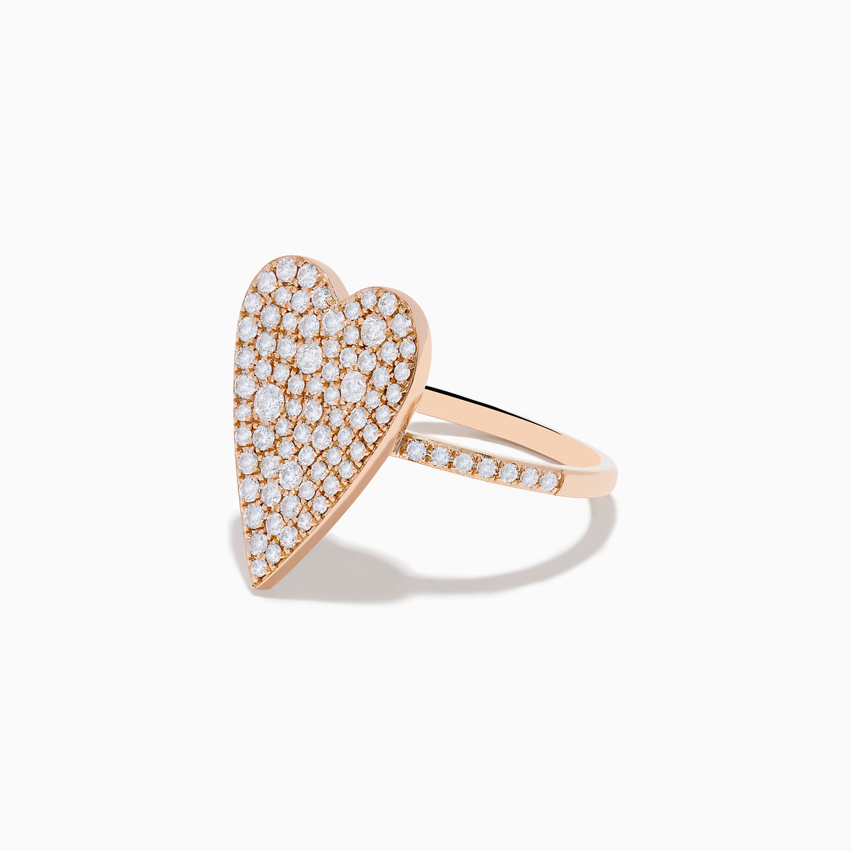 The Pave Rose 14K Rose Gold Diamond Heart Ring features a large diamond-encrusted heart centerpiece with additional diamonds along the band, shown on a white background.