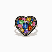 The Watercolors 14K Yellow Gold Multi Color Sapphire and Diamond Heart Ring features a heart-shaped design with vibrant sapphires and sparkling diamonds, set in yellow gold on a white background.