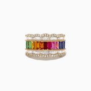 The Watercolor 14k Yellow Gold Multi Sapphire and Diamond Ring showcases a central rainbow row of sapphires bordered by scalloped rows of baguette diamonds.