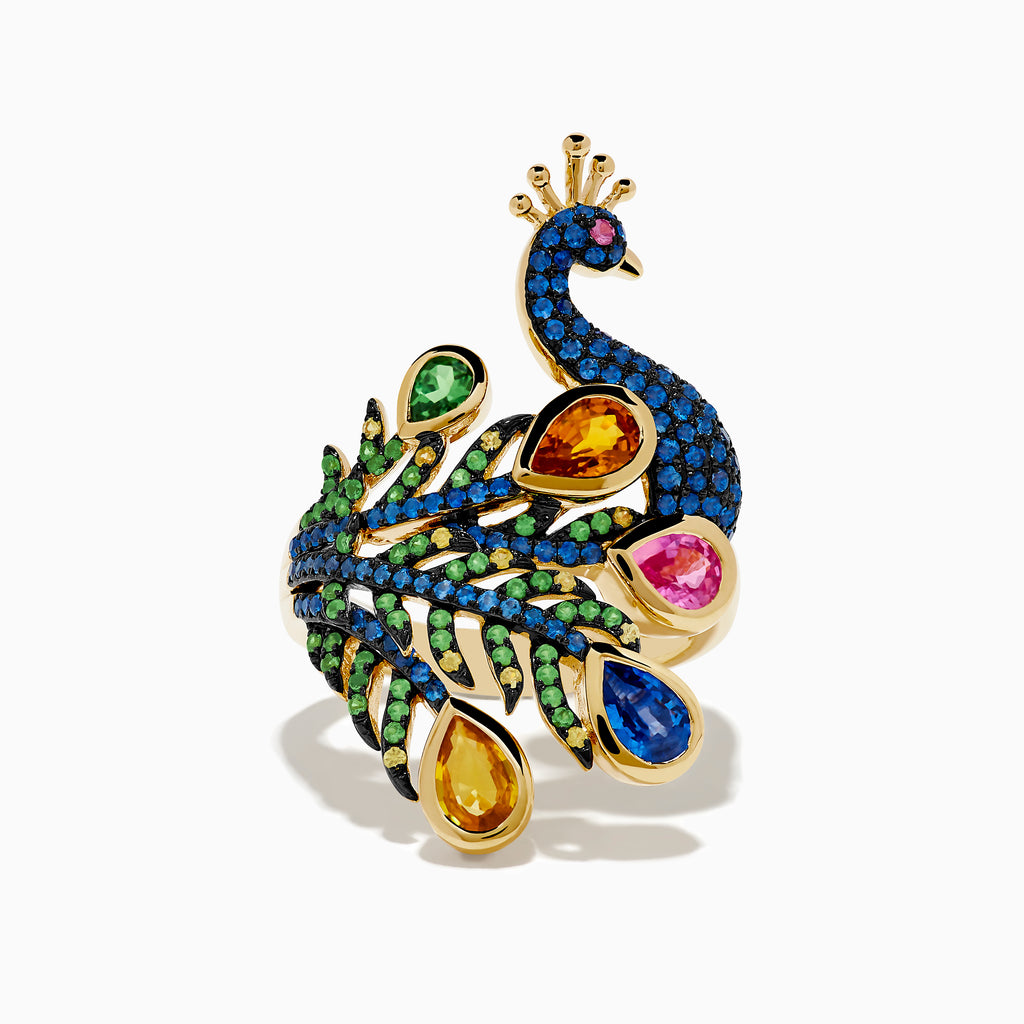 The Safari 14K Yellow Gold Multi Sapphire Peacock Ring features vibrant blue, green, yellow, pink, and orange sapphires with detailed feathers and a jeweled crown, set against a white background.