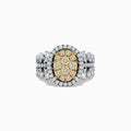 The Canare 14K Two Tone White and Yellow Diamond Ring showcases an oval cluster of yellow diamonds, accented by a white diamond halo and band in a striking multi-row design.