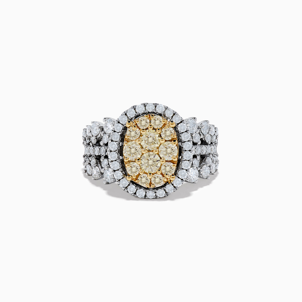 The Canare 14K Two Tone White and Yellow Diamond Ring showcases an oval cluster of yellow diamonds, accented by a white diamond halo and band in a striking multi-row design.