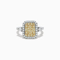 The Canare` 14K Two Tone Gold White and Yellow Diamond Ring showcases a cluster of yellow diamonds at the center, surrounded by white diamonds on a rectangular band.