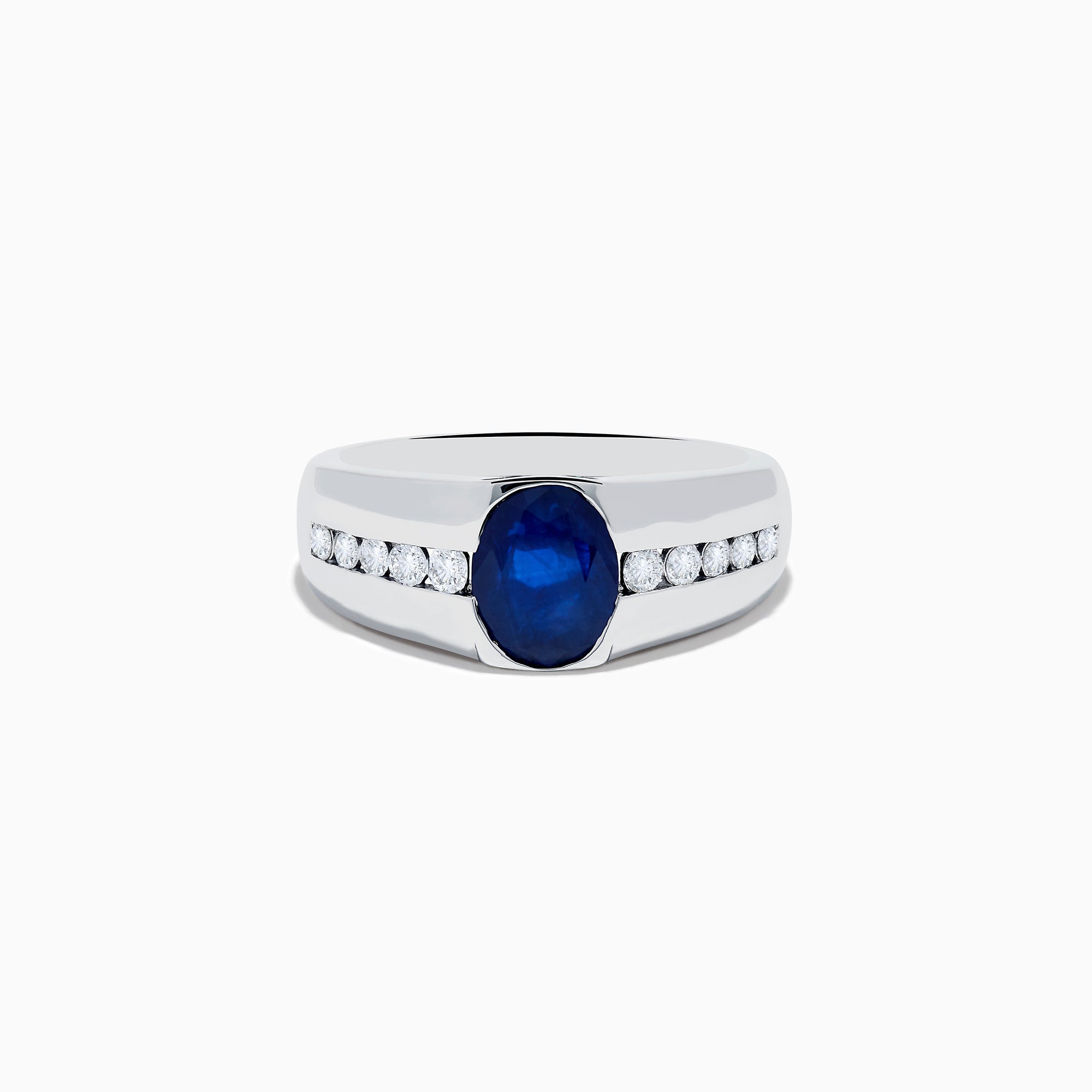 The Mens 14K White Gold Sapphire and Diamond Ring features a large oval blue sapphire at the center, accented on each side by rows of small round white diamonds set into the stylish band.