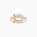 The Novelty 14K Yellow Gold Diamond Horseshoe Ring features baguette-cut diamonds and two small gold spheres at each end, elegantly displayed on a white background.
