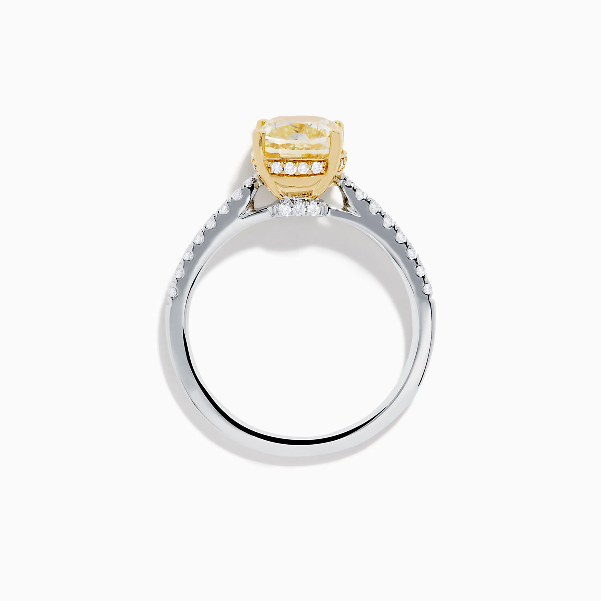 The Canare 18K Two Tone Gold Yellow and White Diamond Ring features a cushion-cut yellow diamond center held by gold prongs, accented with sparkling white diamonds along the band.