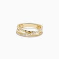 The 14K Yellow Gold Diamond Studded Crossover Ring features three intertwined yellow gold bands, with one pavé set with sparkling white diamonds, shown against a white background.