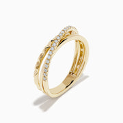 The 14K Yellow Gold Diamond Studded Crossover Ring features three intertwined yellow gold bands, with one pavé set with sparkling white diamonds, shown against a white background.