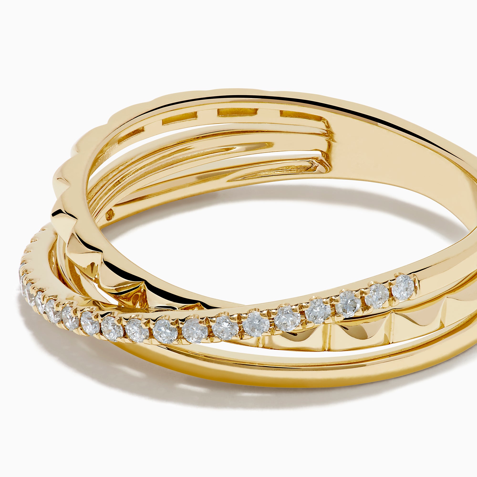 The 14K Yellow Gold Diamond Studded Crossover Ring features three intertwined yellow gold bands, with one pavé set with sparkling white diamonds, shown against a white background.