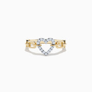 The Novelty 14K Two Tone Gold Diamond Heart Ring showcases a diamond-outlined heart at the center, joined on both sides by a chain-link inspired gold band.