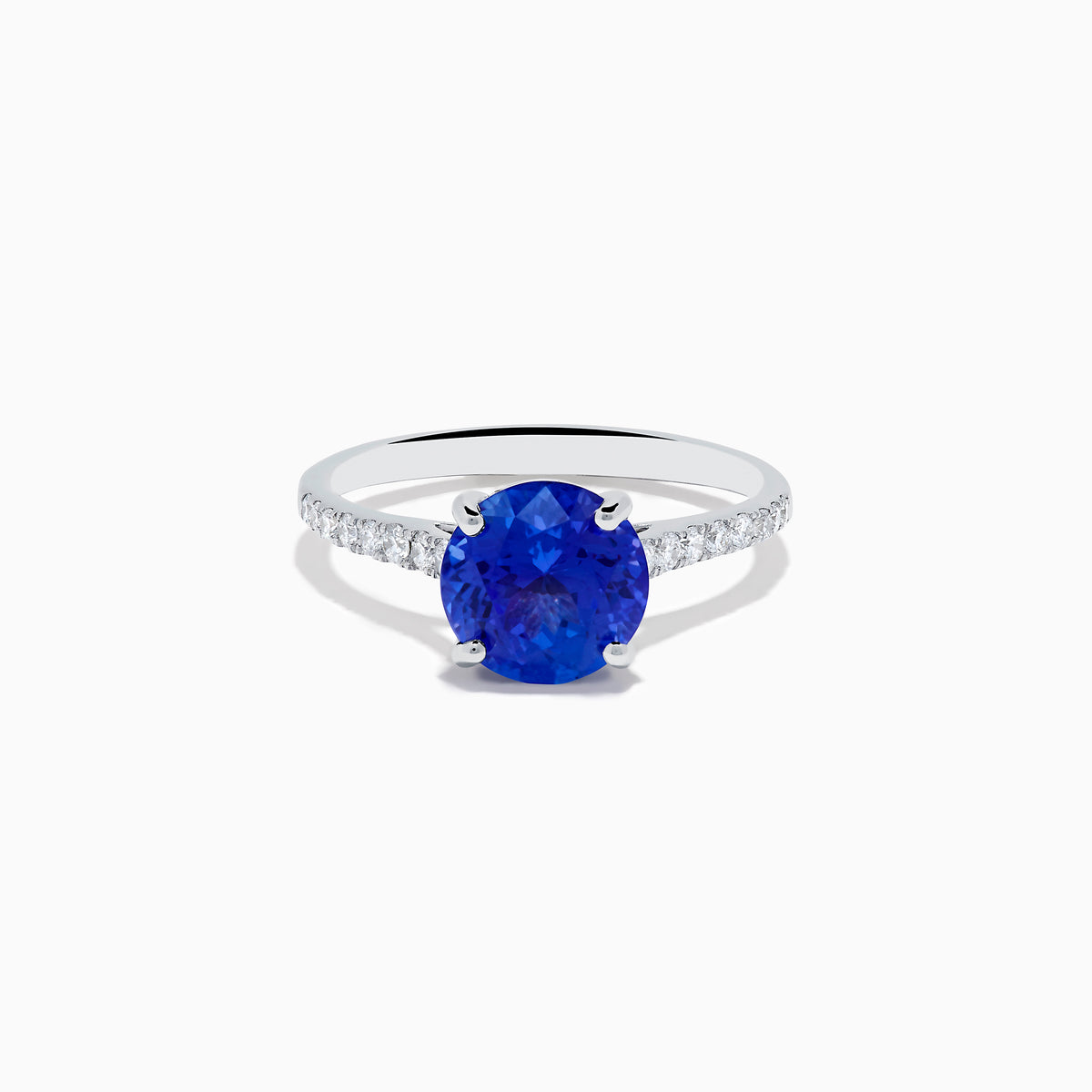 The Nahla 14K White Gold Round Tanzanite and Diamond Ring features a central tanzanite gemstone accented by diamonds along the band, shown against a white background.