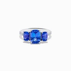 The Nahla 14K White Gold Tanzanite and Diamond 3 Stone Ring showcases three rectangular blue tanzanites at the center, accented by sparkling diamonds along the band.