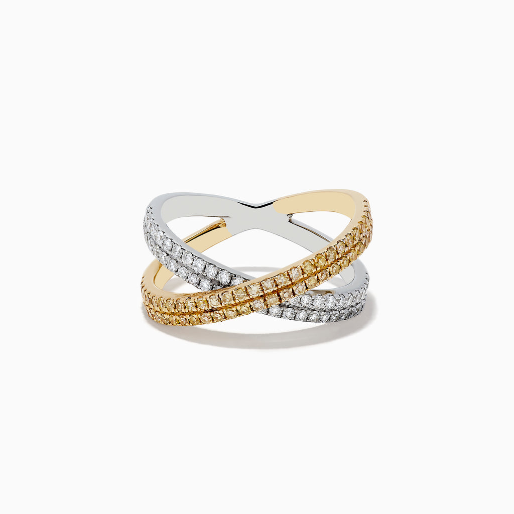 The Canare 14k Two Tone Yellow and White Diamond Criss Cross Ring (0.78 TCW) features intersecting bands—one adorned with white diamonds, the other with yellow—for a dazzling contrast against a white background.