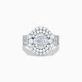 The 14K White Gold Diamond Cluster Ring showcases rectangular and round-cut diamonds in an oval setting with two halo layers on a diamond-accented split shank band.