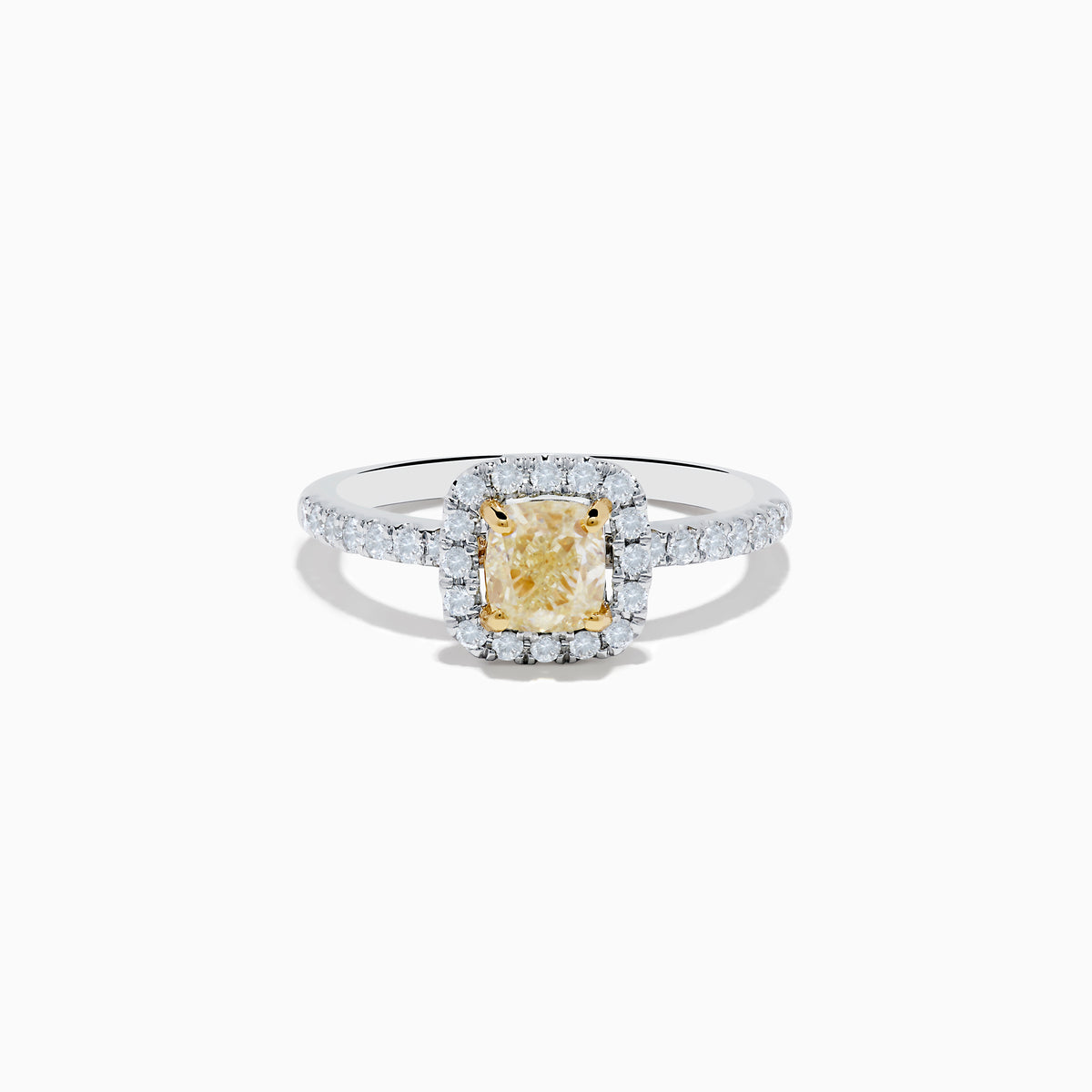 The Canare 18K Two Tone Gold White and Yellow Diamond Ring showcases a cushion-cut yellow diamond center, haloed by white diamonds, with a diamond-adorned band.
