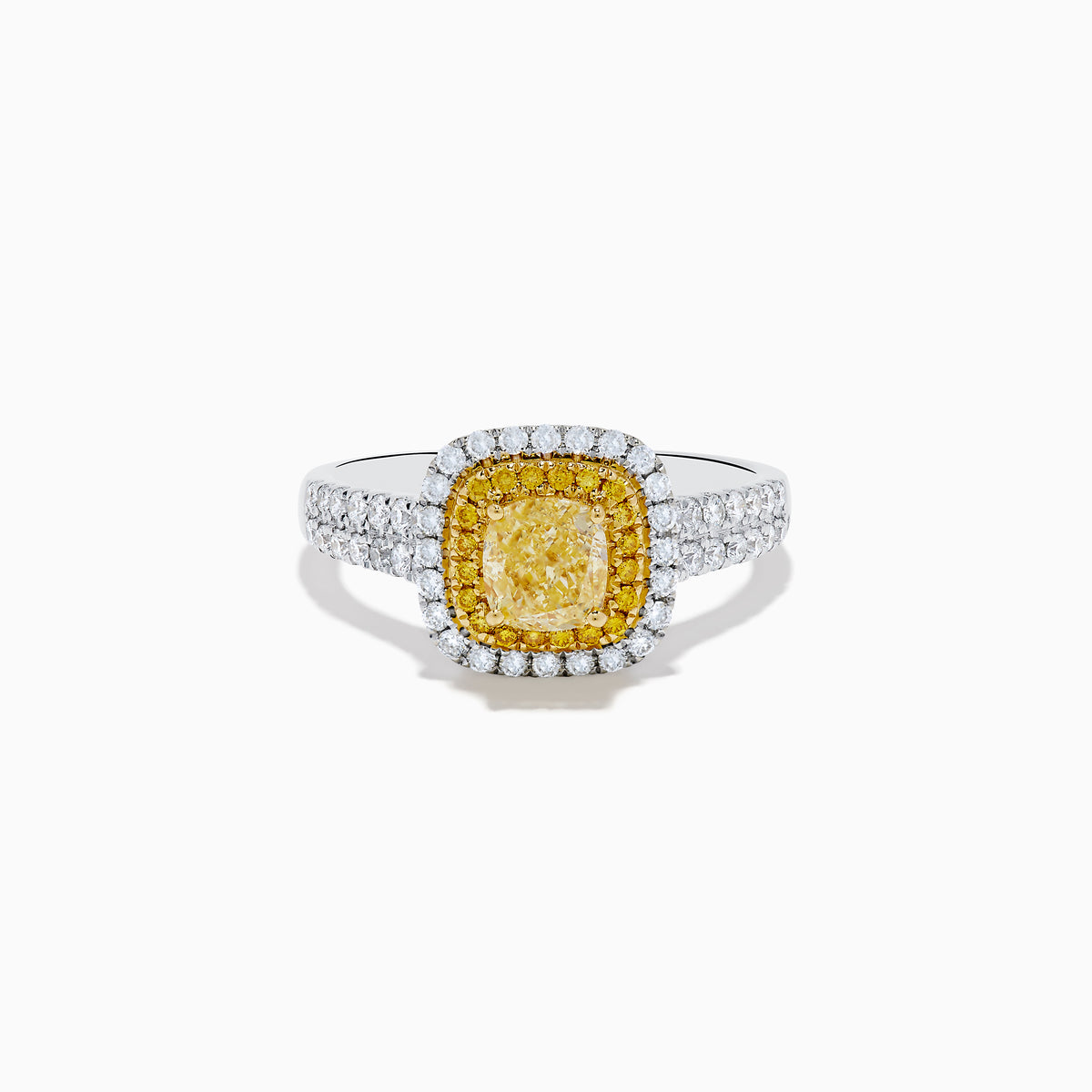 The Canare 18K Two Tone White and Yellow Diamond Ring showcases a square yellow center stone, encircled by yellow and white diamond halos, set on a band adorned with sparkling clear diamonds.