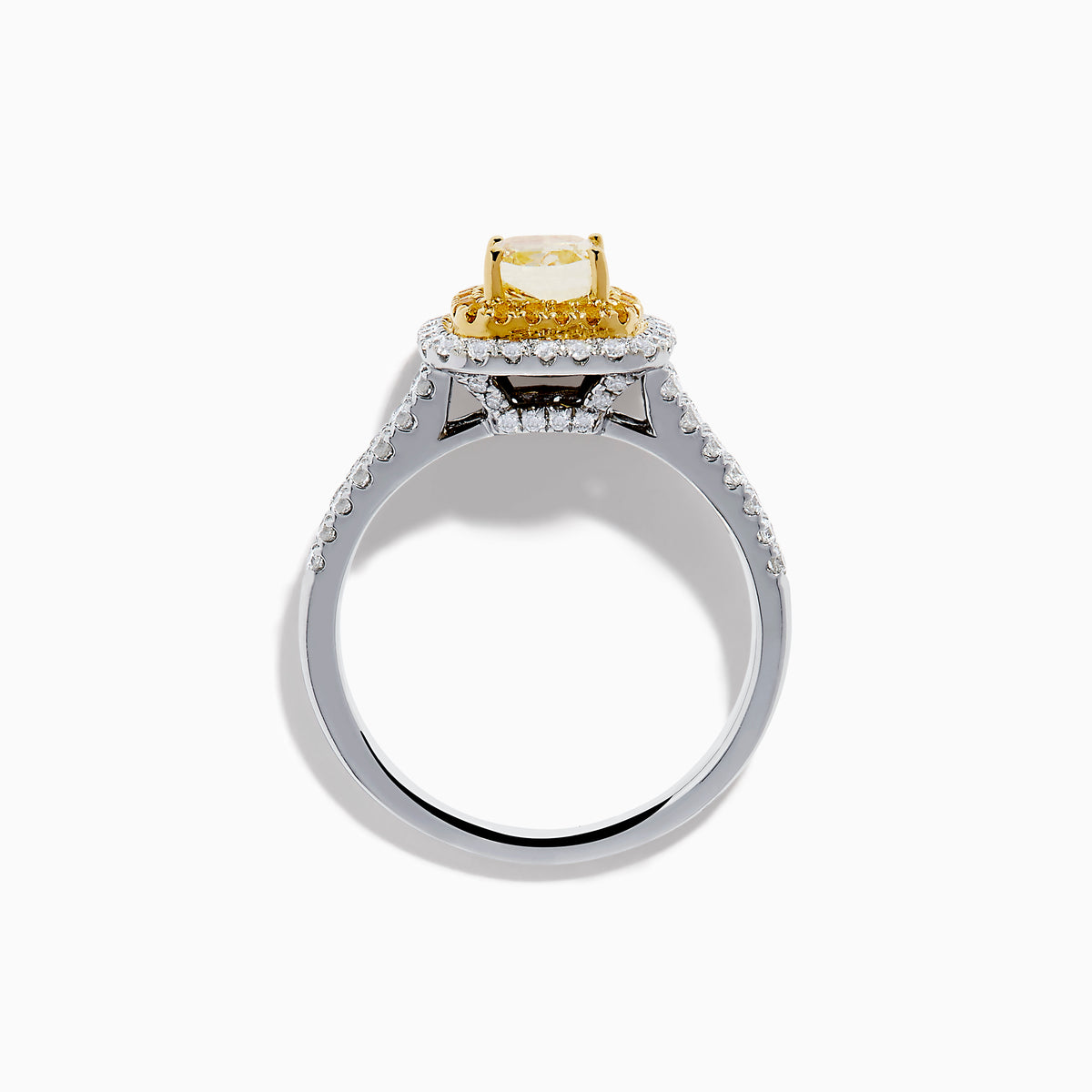 The Canare 18K Two Tone White and Yellow Diamond Ring showcases a square yellow center stone, encircled by yellow and white diamond halos, set on a band adorned with sparkling clear diamonds.