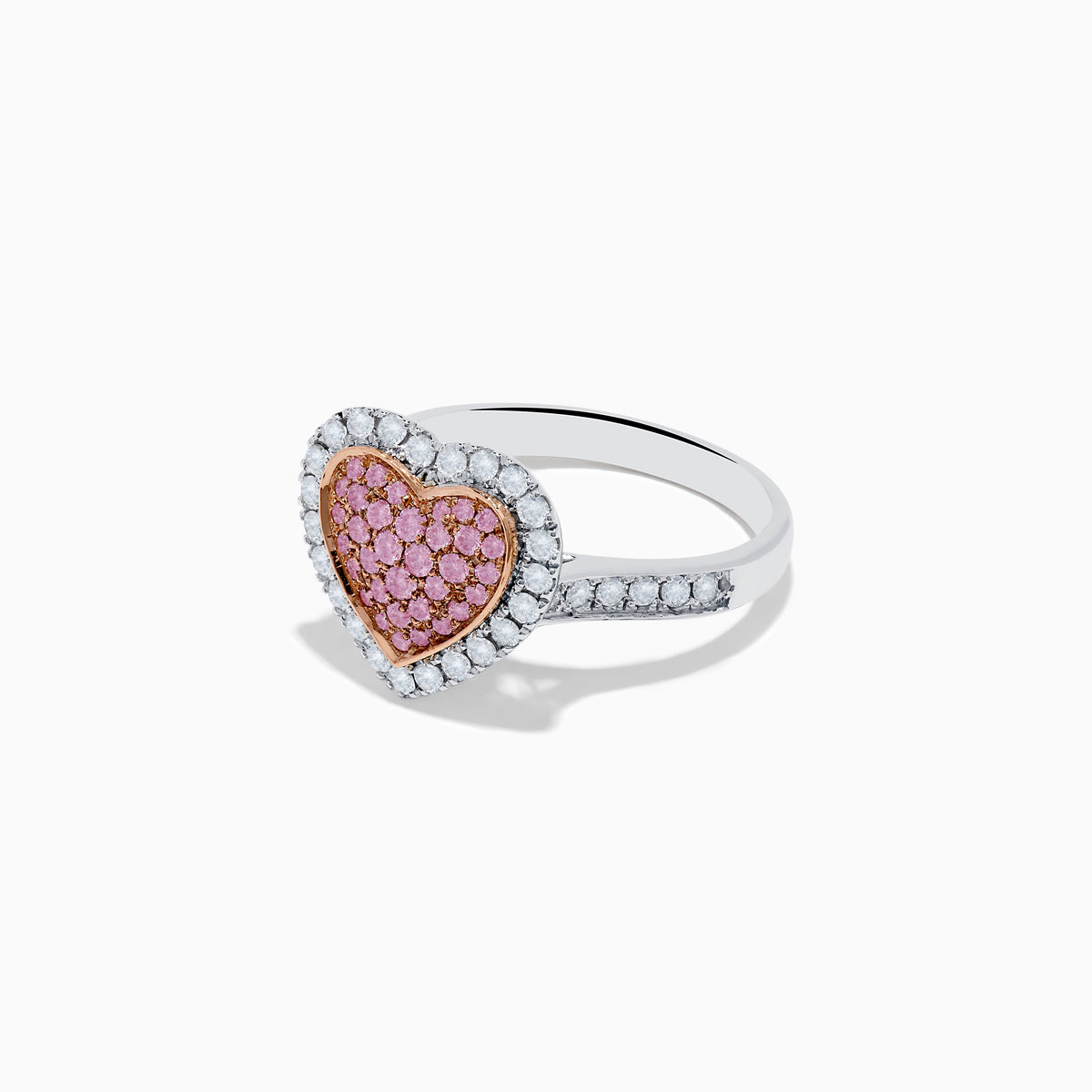 The Novelty 14K Two Tone Gold Pink and White Diamond Heart Ring features a heart-shaped centerpiece set with pink and white diamonds, accented by a sparkling border of clear, white stones.