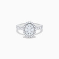 The Bouquet 14K White Gold Diamond Cluster Ring showcases an oval diamond cluster with a double halo of sparkling diamonds and extra diamonds set along the band.